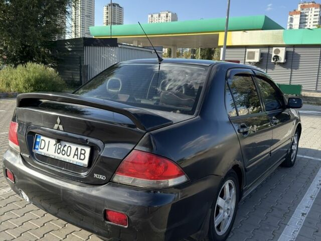 Чорний Міцубісі Lancer, об'ємом двигуна 1.6 л та пробігом 364 тис. км за 3000 $, фото 2 на Automoto.ua