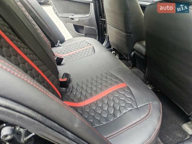 Чорний Міцубісі Lancer, об'ємом двигуна 2 л та пробігом 240 тис. км за 7850 $, фото 31 на Automoto.ua
