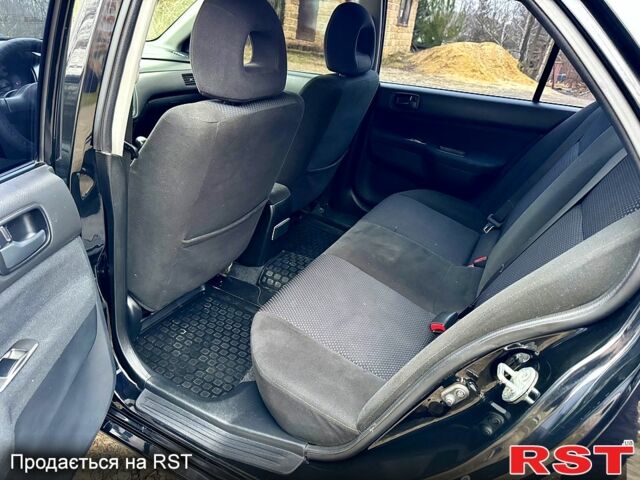 Черный Мицубиси Лансер, объемом двигателя 1.6 л и пробегом 216 тыс. км за 5190 $, фото 9 на Automoto.ua