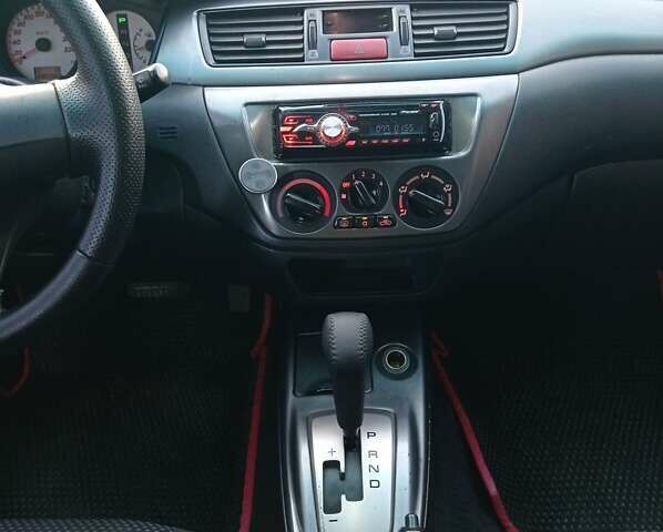 Чорний Міцубісі Lancer, об'ємом двигуна 1.58 л та пробігом 286 тис. км за 4950 $, фото 1 на Automoto.ua