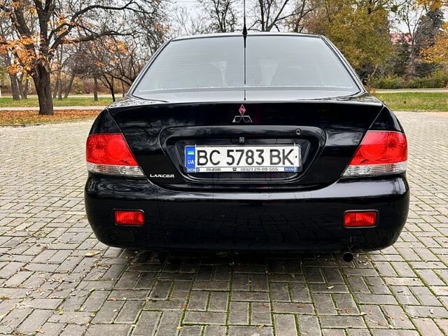 Черный Мицубиси Лансер, объемом двигателя 1.6 л и пробегом 185 тыс. км за 5500 $, фото 3 на Automoto.ua