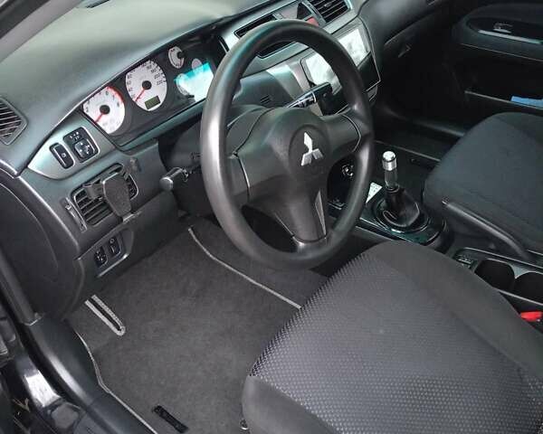 Мицубиси Лансер 2008 в Львове на Automoto.ua Черный Мицубиси Лансер, объемом двигателя 1.58 л и пробегом 200 тыс. км за 5200 $, фото 215 на Automoto.ua