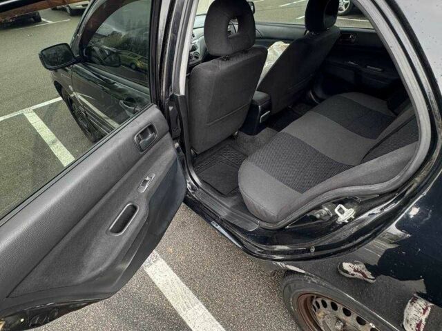 Чорний Міцубісі Lancer, об'ємом двигуна 1.6 л та пробігом 245 тис. км за 4500 $, фото 18 на Automoto.ua