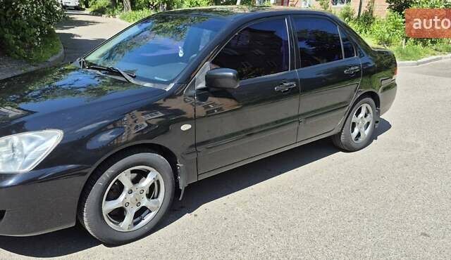 Чорний Міцубісі Lancer, об'ємом двигуна 1.6 л та пробігом 210 тис. км за 4800 $, фото 3 на Automoto.ua