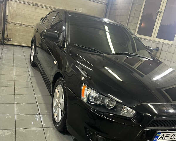 Черный Мицубиси Лансер, объемом двигателя 2 л и пробегом 200 тыс. км за 8000 $, фото 3 на Automoto.ua