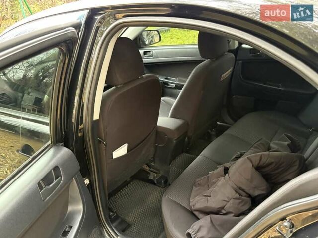 Черный Мицубиси Лансер, объемом двигателя 2 л и пробегом 260 тыс. км за 6100 $, фото 15 на Automoto.ua