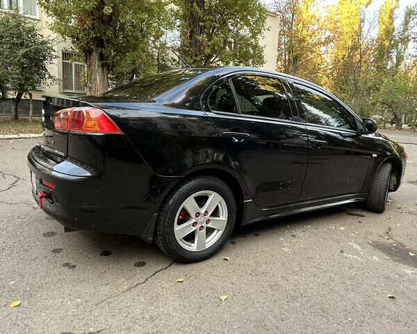 Чорний Міцубісі Lancer, об'ємом двигуна 2 л та пробігом 206 тис. км за 5600 $, фото 37 на Automoto.ua