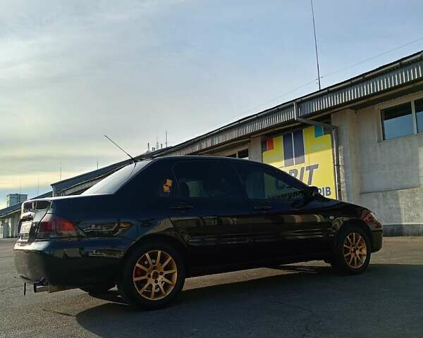 Мицубиси Лансер 2008 в Львове на Automoto.ua Черный Мицубиси Лансер, объемом двигателя 1.58 л и пробегом 200 тыс. км за 5200 $, фото 80 на Automoto.ua