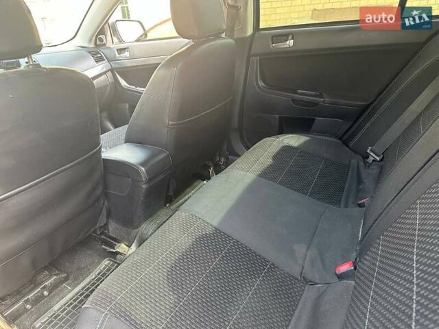 Чорний Міцубісі Lancer, об'ємом двигуна 2 л та пробігом 278 тис. км за 6600 $, фото 10 на Automoto.ua