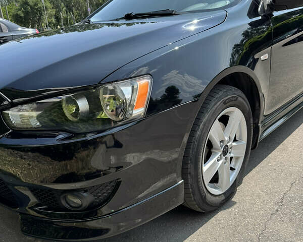 Чорний Міцубісі Lancer, об'ємом двигуна 2 л та пробігом 217 тис. км за 7800 $, фото 39 на Automoto.ua