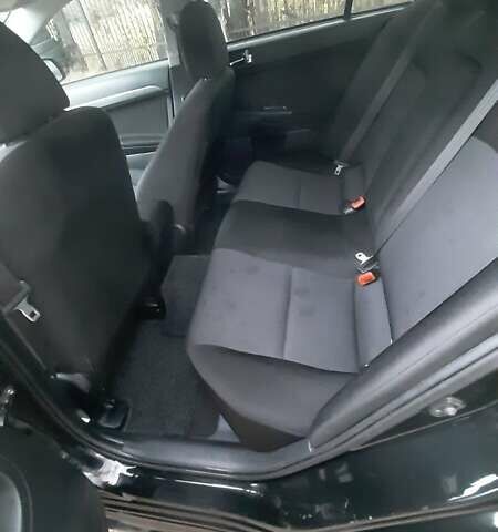 Черный Мицубиси Лансер, объемом двигателя 2 л и пробегом 63 тыс. км за 8000 $, фото 6 на Automoto.ua