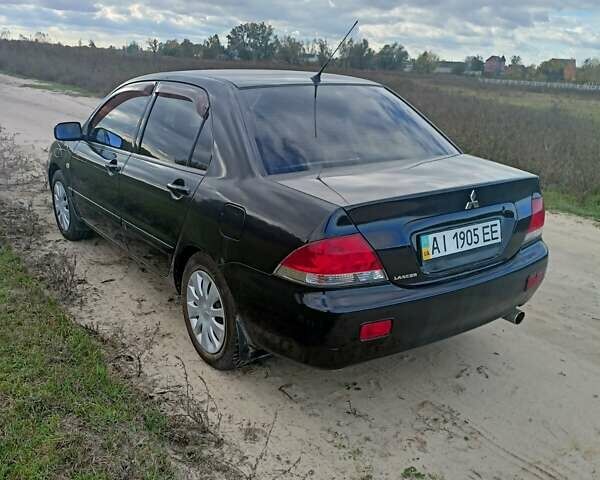 Чорний Міцубісі Lancer, об'ємом двигуна 1.58 л та пробігом 172 тис. км за 4500 $, фото 16 на Automoto.ua