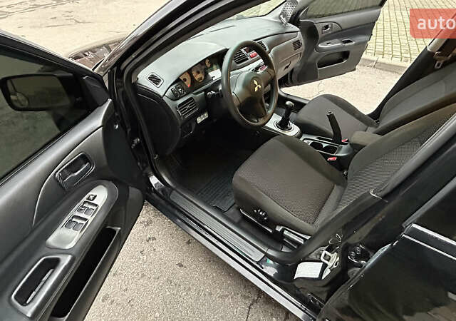 Чорний Міцубісі Lancer, об'ємом двигуна 1.58 л та пробігом 167 тис. км за 4800 $, фото 9 на Automoto.ua