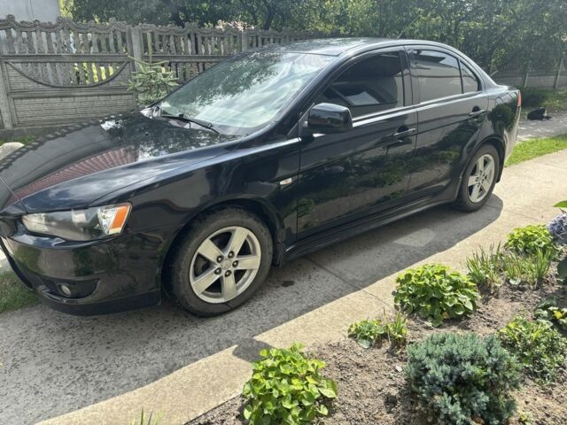 Черный Мицубиси Лансер, объемом двигателя 2 л и пробегом 210 тыс. км за 6250 $, фото 1 на Automoto.ua