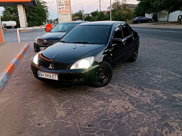 Чорний Міцубісі Lancer, об'ємом двигуна 1.6 л та пробігом 0 тис. км за 4200 $, фото 9 на Automoto.ua