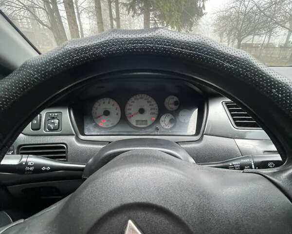 Черный Мицубиси Лансер, объемом двигателя 1.58 л и пробегом 214 тыс. км за 4400 $, фото 23 на Automoto.ua