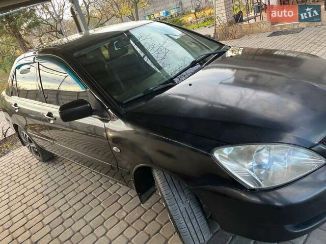 Чорний Міцубісі Lancer, об'ємом двигуна 1.6 л та пробігом 324 тис. км за 3800 $, фото 3 на Automoto.ua