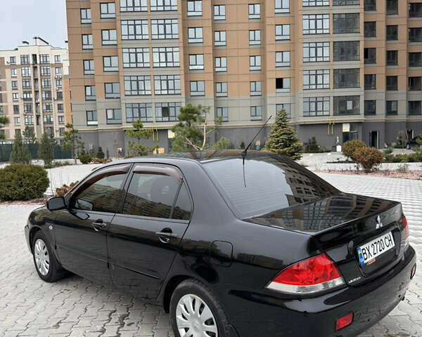 Черный Мицубиси Лансер, объемом двигателя 1.6 л и пробегом 240 тыс. км за 5200 $, фото 6 на Automoto.ua