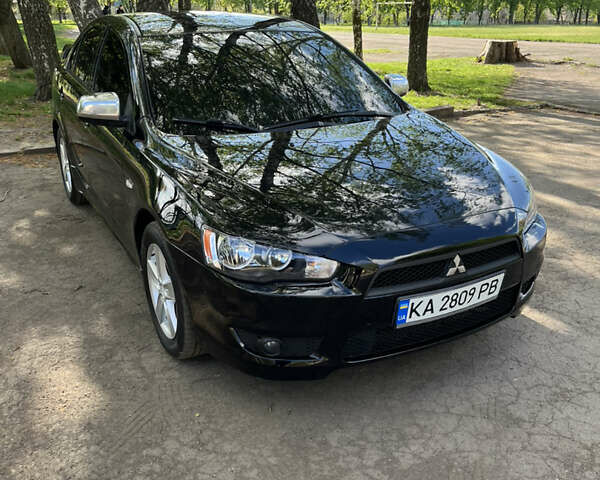 Чорний Міцубісі Lancer, об'ємом двигуна 2 л та пробігом 292 тис. км за 6650 $, фото 1 на Automoto.ua