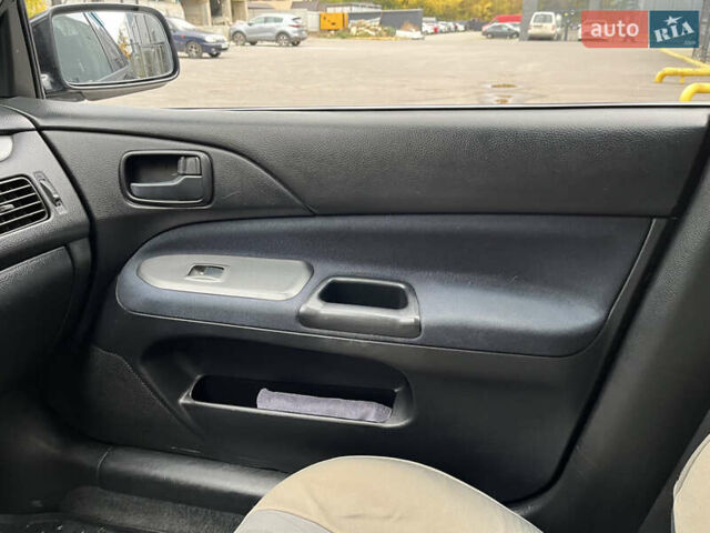 Чорний Міцубісі Lancer, об'ємом двигуна 1.58 л та пробігом 192 тис. км за 4500 $, фото 14 на Automoto.ua