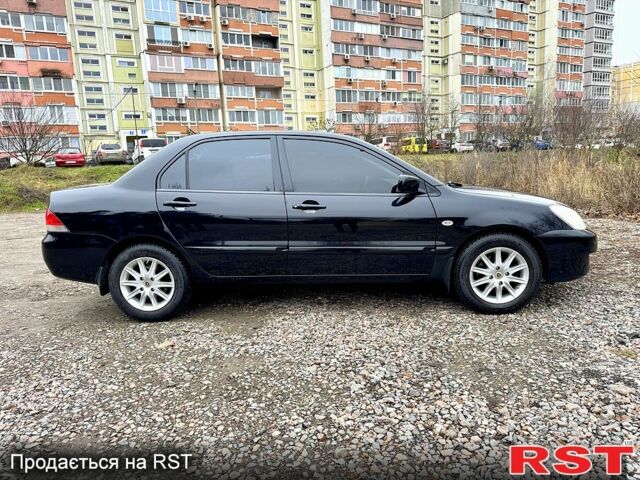 Черный Мицубиси Лансер, объемом двигателя 1.6 л и пробегом 216 тыс. км за 5190 $, фото 5 на Automoto.ua