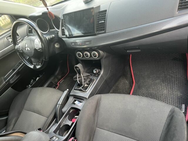 Черный Мицубиси Лансер, объемом двигателя 2 л и пробегом 270 тыс. км за 5600 $, фото 9 на Automoto.ua