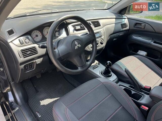 Чорний Міцубісі Lancer, об'ємом двигуна 1.6 л та пробігом 296 тис. км за 4200 $, фото 33 на Automoto.ua