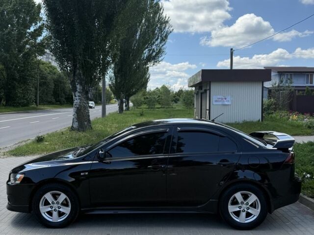 Чорний Міцубісі Lancer, об'ємом двигуна 2 л та пробігом 163 тис. км за 8000 $, фото 1 на Automoto.ua