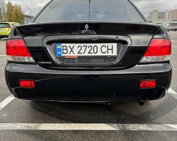 Чорний Міцубісі Lancer, об'ємом двигуна 1.6 л та пробігом 245 тис. км за 4500 $, фото 8 на Automoto.ua