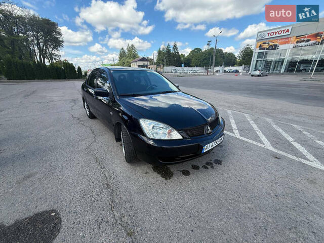 Чорний Міцубісі Lancer, об'ємом двигуна 1.6 л та пробігом 292 тис. км за 3600 $, фото 9 на Automoto.ua