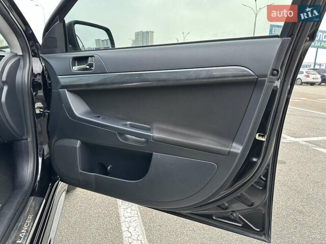Чорний Міцубісі Lancer, об'ємом двигуна 2 л та пробігом 199 тис. км за 7900 $, фото 22 на Automoto.ua