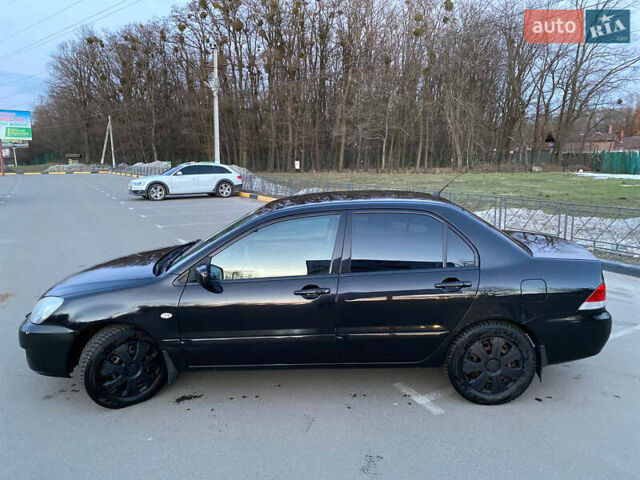 Чорний Міцубісі Lancer, об'ємом двигуна 1.58 л та пробігом 327 тис. км за 4000 $, фото 8 на Automoto.ua