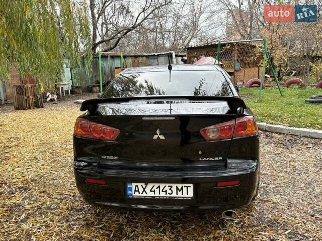 Черный Мицубиси Лансер, объемом двигателя 2 л и пробегом 260 тыс. км за 6100 $, фото 6 на Automoto.ua