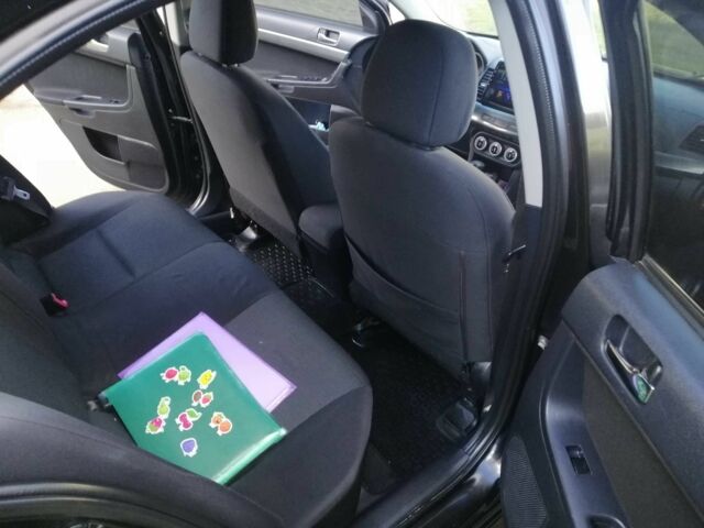 Міцубісі Lancer 2008 у Києві на Automoto.ua Чорний Міцубісі Lancer, об'ємом двигуна 2 л та пробігом 196 тис. км за 5500 $, фото 18 на Automoto.ua