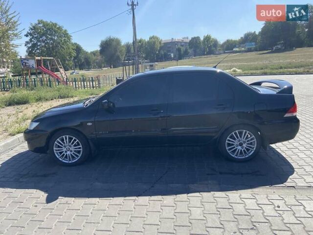 Чорний Міцубісі Lancer, об'ємом двигуна 1.58 л та пробігом 260 тис. км за 4800 $, фото 3 на Automoto.ua