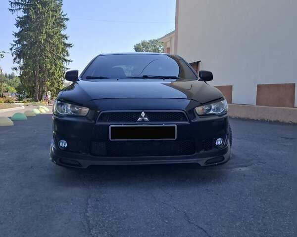 Черный Мицубиси Лансер, объемом двигателя 2 л и пробегом 230 тыс. км за 7000 $, фото 24 на Automoto.ua