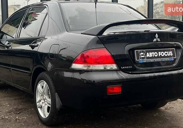 Чорний Міцубісі Lancer, об'ємом двигуна 1.6 л та пробігом 340 тис. км за 6190 $, фото 5 на Automoto.ua
