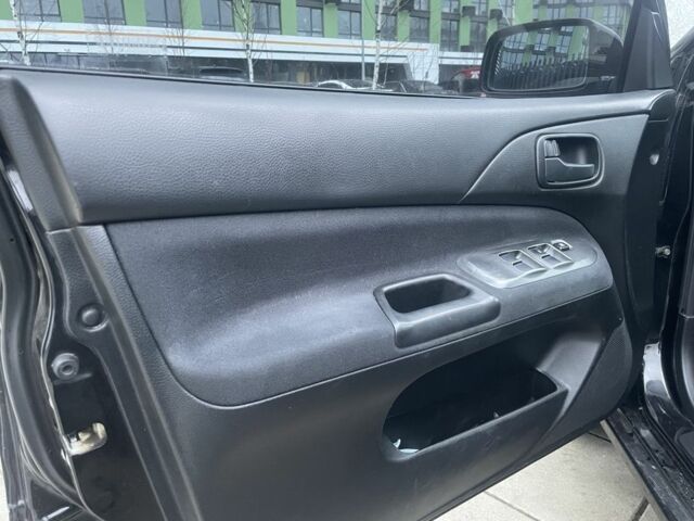 Черный Мицубиси Лансер, объемом двигателя 1.6 л и пробегом 226 тыс. км за 3750 $, фото 11 на Automoto.ua