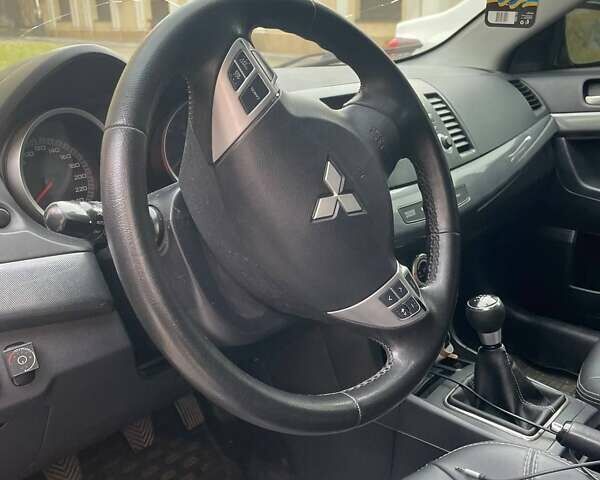 Чорний Міцубісі Lancer, об'ємом двигуна 2 л та пробігом 255 тис. км за 6999 $, фото 9 на Automoto.ua