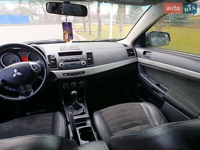 Черный Мицубиси Лансер, объемом двигателя 2 л и пробегом 200 тыс. км за 5100 $, фото 6 на Automoto.ua