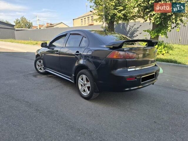 Черный Мицубиси Лансер, объемом двигателя 2 л и пробегом 230 тыс. км за 7000 $, фото 22 на Automoto.ua