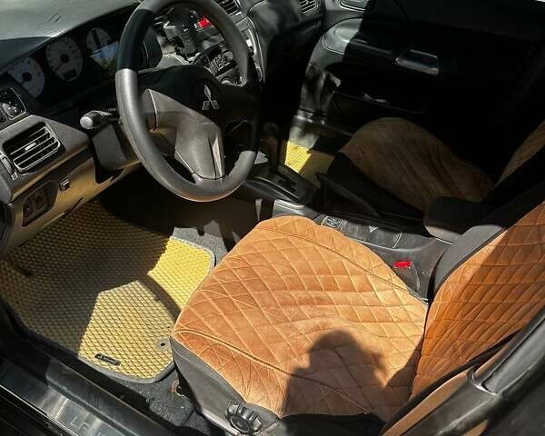 Чорний Міцубісі Lancer, об'ємом двигуна 1.6 л та пробігом 294 тис. км за 6500 $, фото 13 на Automoto.ua