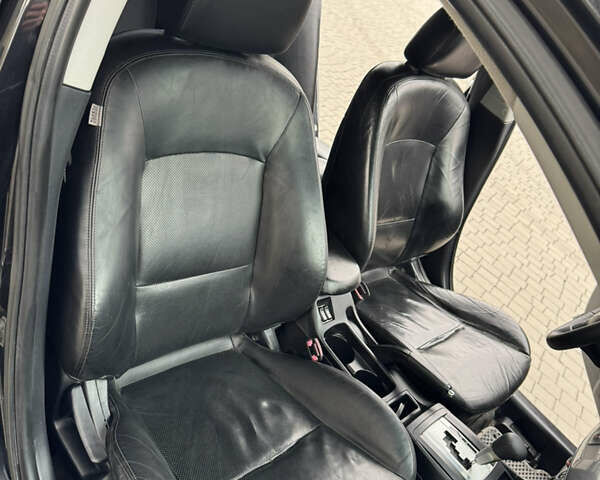 Чорний Міцубісі Lancer, об'ємом двигуна 2 л та пробігом 200 тис. км за 6800 $, фото 4 на Automoto.ua