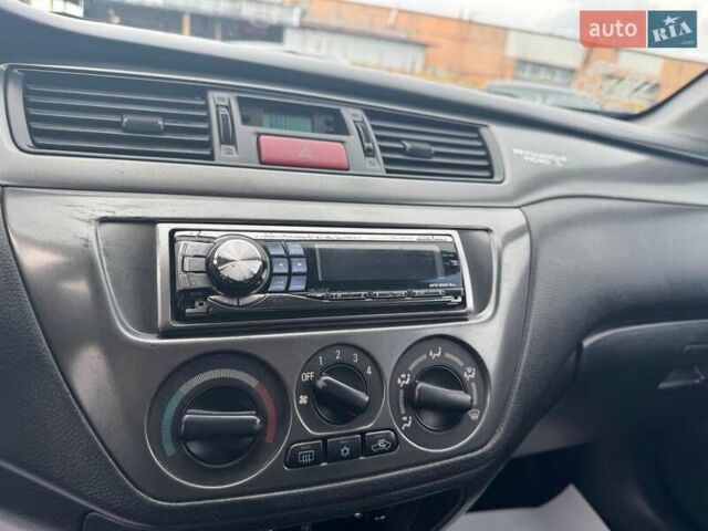 Мицубиси Лансер 2008 в Запорожье на Automoto.ua Черный Мицубиси Лансер, объемом двигателя 1.6 л и пробегом 316 тыс. км за 4290 $, фото 16 на Automoto.ua