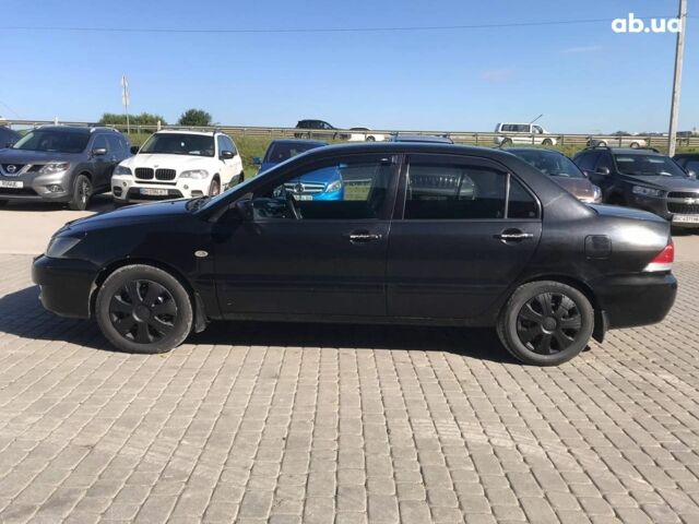 Чорний Міцубісі Lancer, об'ємом двигуна 1.6 л та пробігом 356 тис. км за 4590 $, фото 14 на Automoto.ua