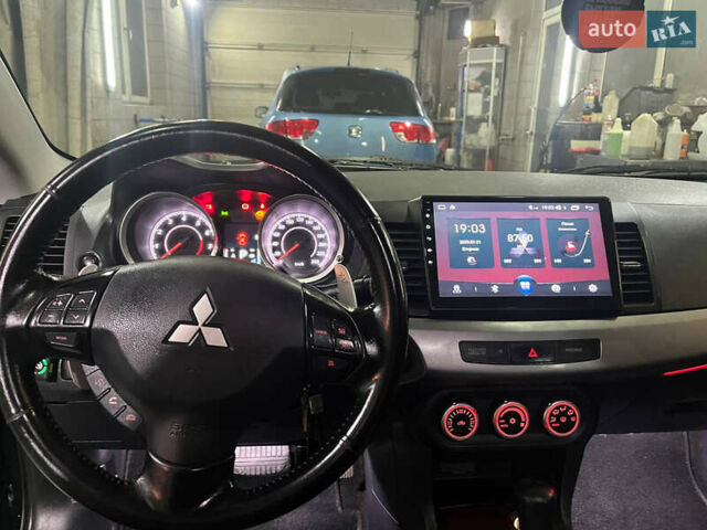 Черный Мицубиси Лансер, объемом двигателя 2 л и пробегом 200 тыс. км за 8000 $, фото 4 на Automoto.ua