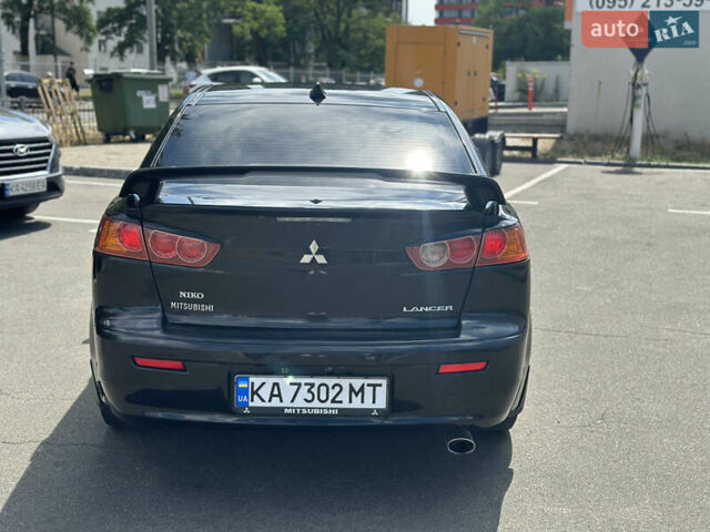 Черный Мицубиси Лансер, объемом двигателя 2 л и пробегом 295 тыс. км за 7000 $, фото 4 на Automoto.ua