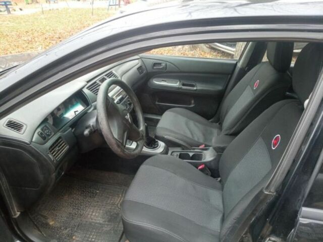 Черный Мицубиси Лансер, объемом двигателя 6 л и пробегом 190 тыс. км за 4500 $, фото 2 на Automoto.ua