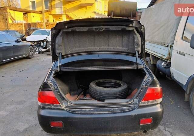 Черный Мицубиси Лансер, объемом двигателя 1.6 л и пробегом 200 тыс. км за 2000 $, фото 11 на Automoto.ua