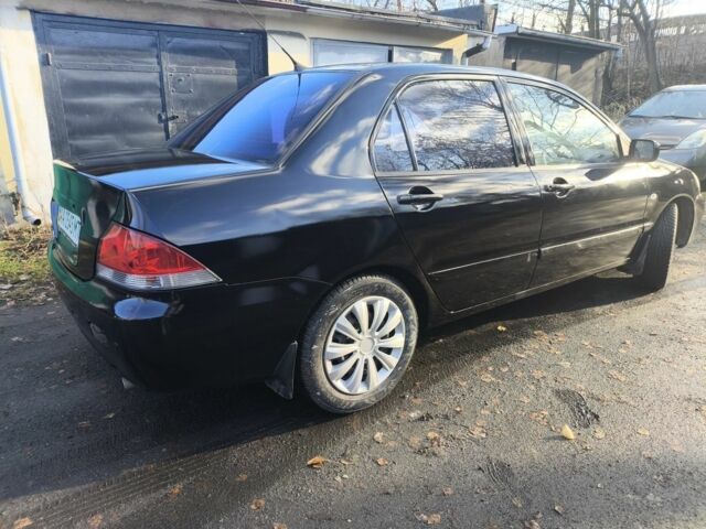 Черный Мицубиси Лансер, объемом двигателя 1.6 л и пробегом 243 тыс. км за 3200 $, фото 5 на Automoto.ua